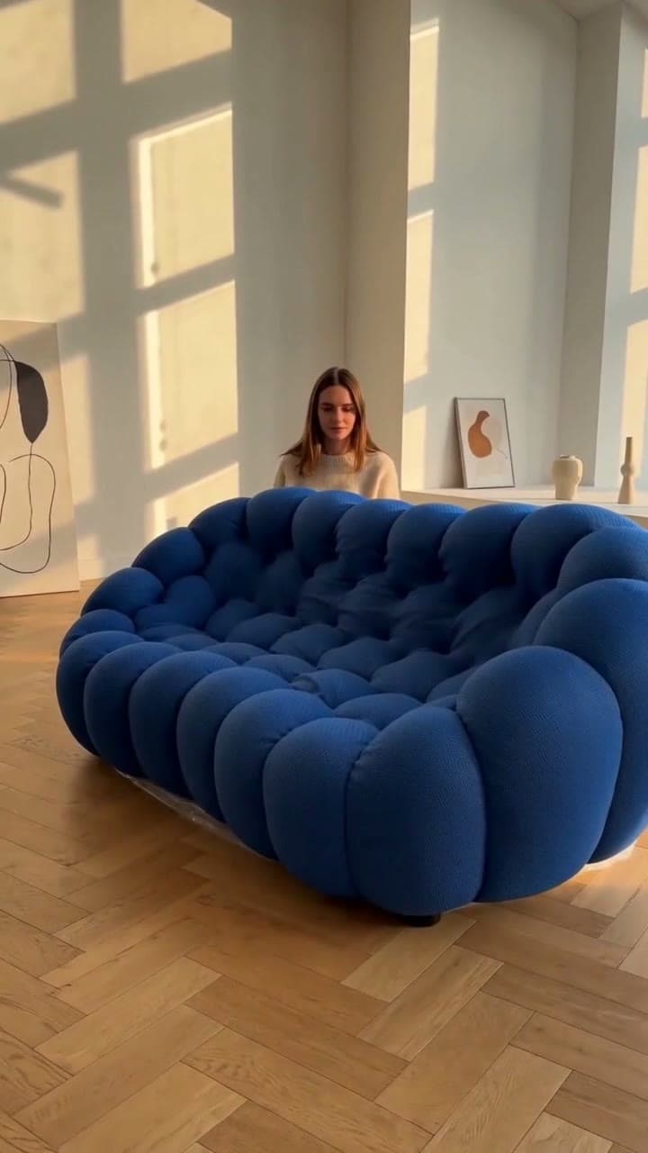 Blue BoxSofa expanding from its compressed delivery package